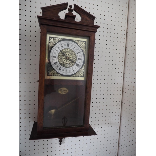 117 - A modern mahogany cased wall clock, 23