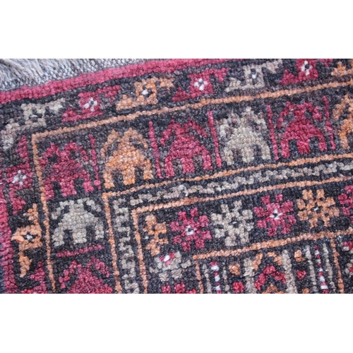 542 - A Middle Eastern prayer rug with geometric designs and star design borders, in shades of natural pin... 