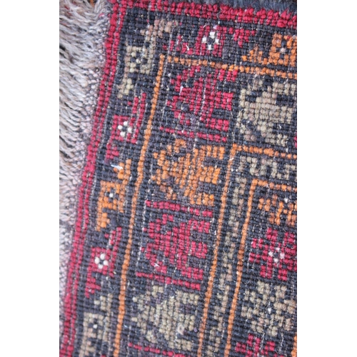 542 - A Middle Eastern prayer rug with geometric designs and star design borders, in shades of natural pin... 