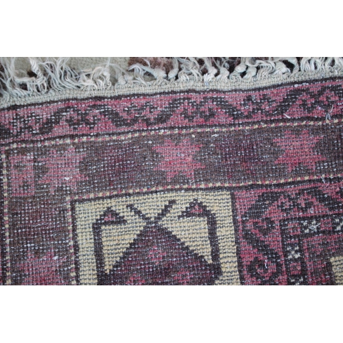 542 - A Middle Eastern prayer rug with geometric designs and star design borders, in shades of natural pin... 