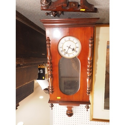 111 - An early 20th century mahogany cased wall clock with white enamel dial and eight-day striking moveme... 