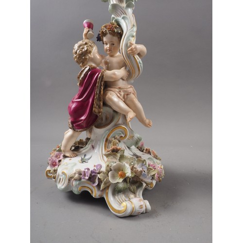 26 - A pair late 19th century Meissen three-branch candelabra with followers of Bacchus decoration, 13 1/... 