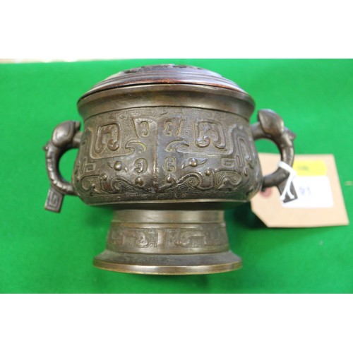 91 - A Chinese brass two-handled censer or archaic design with carved hardwood cover, six-character mark ... 