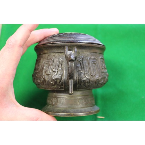 91 - A Chinese brass two-handled censer or archaic design with carved hardwood cover, six-character mark ... 