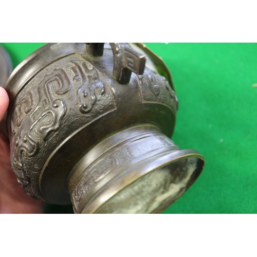 91 - A Chinese brass two-handled censer or archaic design with carved hardwood cover, six-character mark ... 