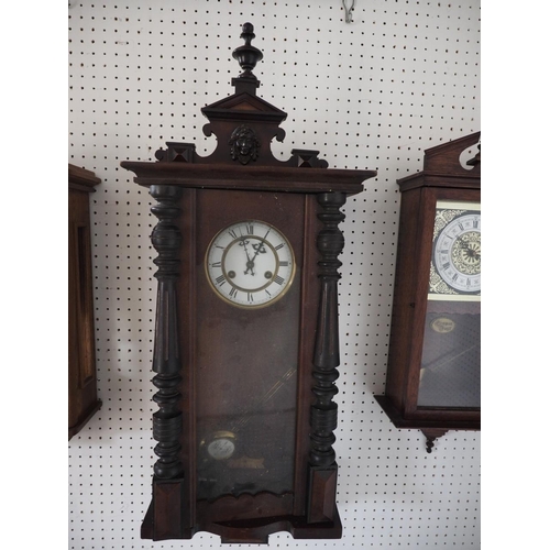 121 - A polished as mahogany regulator style wall clock with shaped pediment and eight-day striking moveme... 