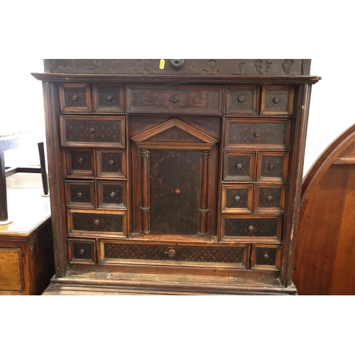 402 - An 18th century Continental walnut and decorated cabinet of drawers, with pull out central cupboard ... 