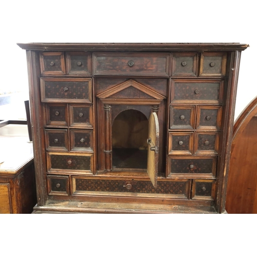 402 - An 18th century Continental walnut and decorated cabinet of drawers, with pull out central cupboard ... 