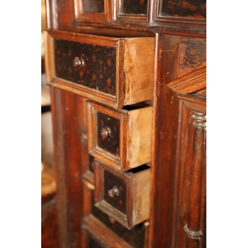 402 - An 18th century Continental walnut and decorated cabinet of drawers, with pull out central cupboard ... 