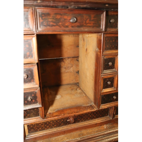 402 - An 18th century Continental walnut and decorated cabinet of drawers, with pull out central cupboard ... 