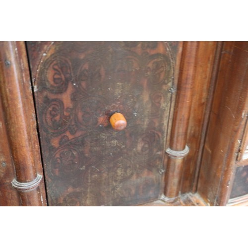 402 - An 18th century Continental walnut and decorated cabinet of drawers, with pull out central cupboard ... 