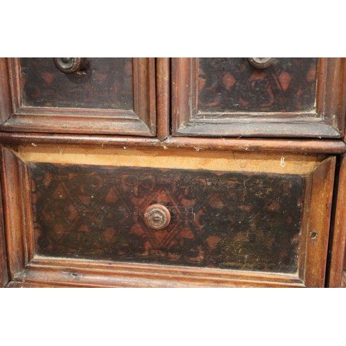 402 - An 18th century Continental walnut and decorated cabinet of drawers, with pull out central cupboard ... 