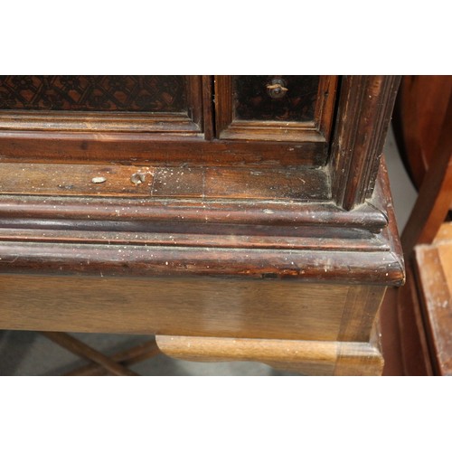 402 - An 18th century Continental walnut and decorated cabinet of drawers, with pull out central cupboard ... 