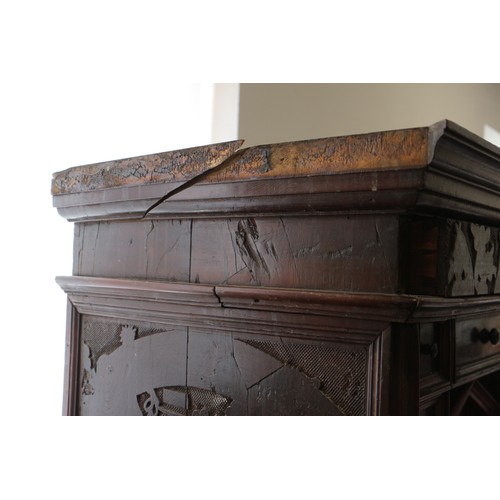 402 - An 18th century Continental walnut and decorated cabinet of drawers, with pull out central cupboard ... 