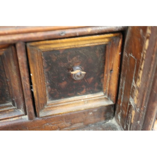 402 - An 18th century Continental walnut and decorated cabinet of drawers, with pull out central cupboard ... 