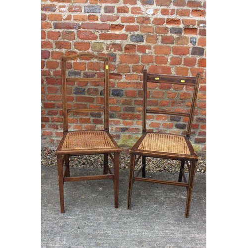 476 - An early 20th century walnut two-tier occasional table, on castored splay supports, 30