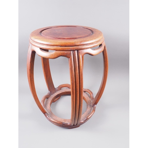 104 - A Chinese hardwood barrel stool, 18