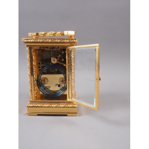 117 - An early 20th century Strydhagen style five-window and gilt metal hour striking carriage clock with ... 