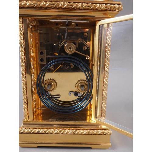 117 - An early 20th century Strydhagen style five-window and gilt metal hour striking carriage clock with ... 