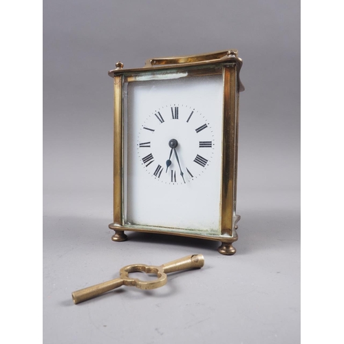 118 - A brass cased carriage clock with white enamel dial and Roman numerals, 4 1/2