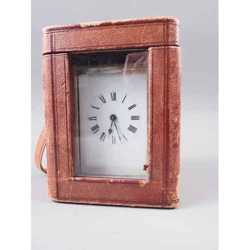 118 - A brass cased carriage clock with white enamel dial and Roman numerals, 4 1/2