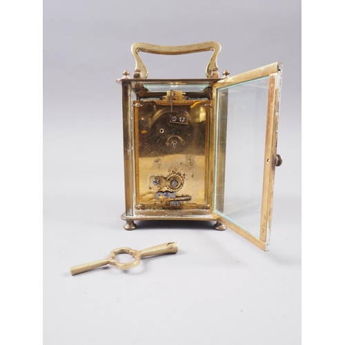 118 - A brass cased carriage clock with white enamel dial and Roman numerals, 4 1/2