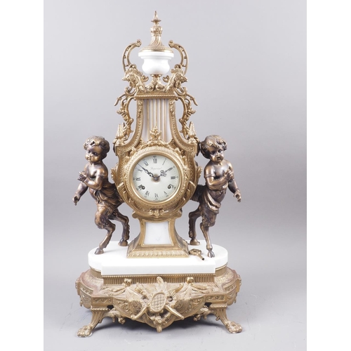 125 - An Imperial reproduction brass and marble mantel clock flanked by fauns with a cream enamel dial and... 