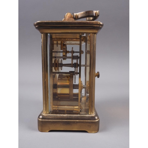 126 - A Matthew Norman brass cased carriage clock with white enamel dial and Roman numerals, 4 3/4