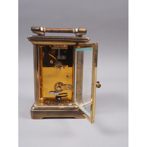 126 - A Matthew Norman brass cased carriage clock with white enamel dial and Roman numerals, 4 3/4