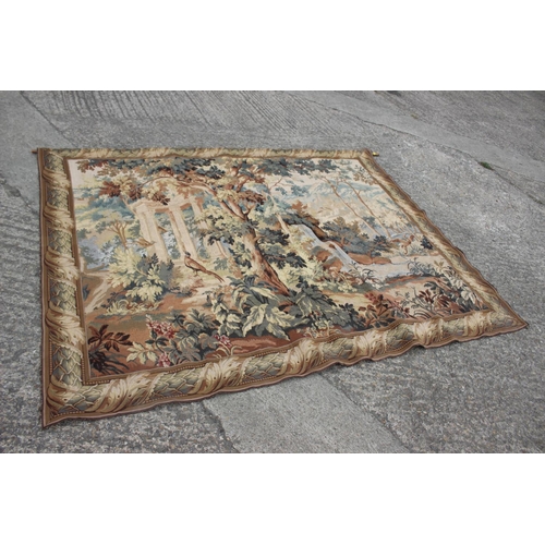 175 - A  Jacquard woven verdure tapestry wall hanging, decorated classical ruins in woodland, 65