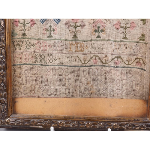 180 - An alphabetical, floral and verse sampler, by Mary Boxall on 18th October 1787, in carved gilt strip... 