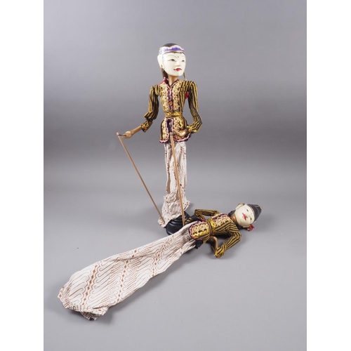 195 - A pair of Javanese carved and painted wooden puppets, 21