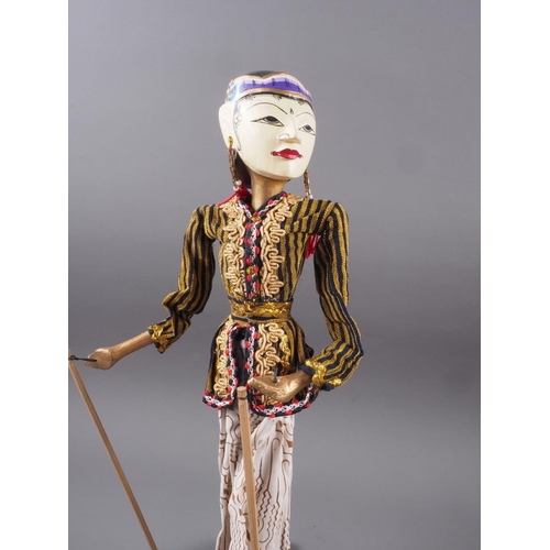 195 - A pair of Javanese carved and painted wooden puppets, 21