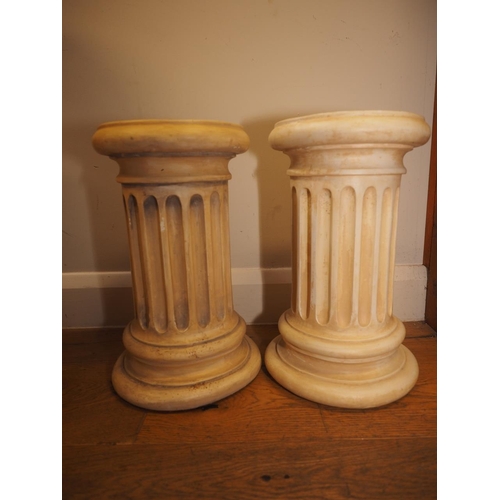 207 - A pair of composition fluted column stands, 9