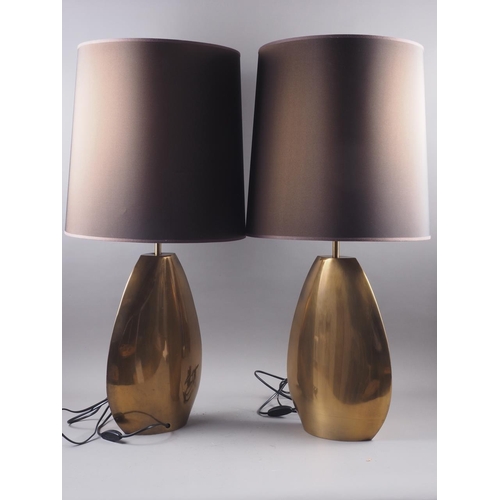 214 - A pair of oval brass modernist style lamp bases with brown shades, 17 1/2