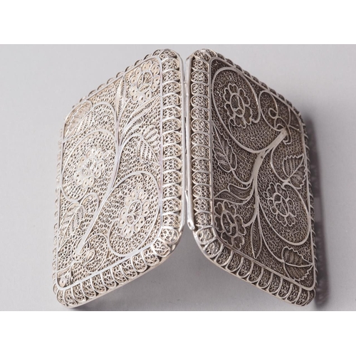 237 - A white metal filigree cigarette case, 2.8oz troy approx