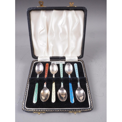 255 - A five-piece silver cruet set with pierced decoration and blue glass liners, a cased set of six colo... 