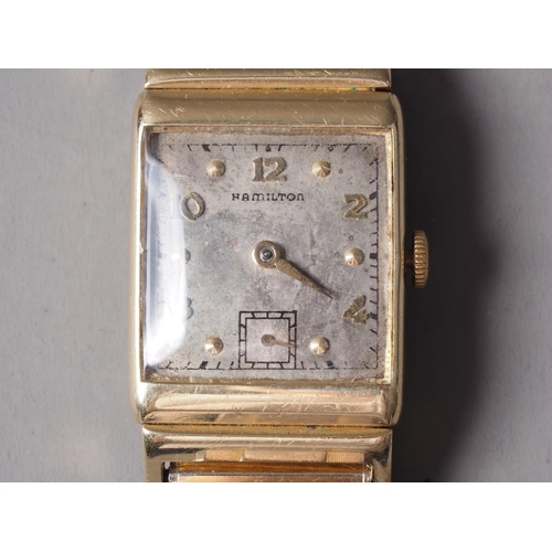 257 - A gentleman's 14ct gold cased Hamilton wristwatch with silvered dial and Arabic numerals, on later e... 