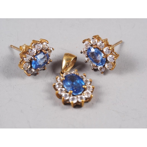 262 - A pair of earrings and matching pendant, set coral and white stones, and a similar, set blue and whi... 