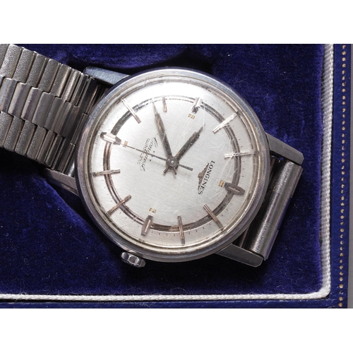 267 - A gentleman's Longines Conquest stainless steel automatic wristwatch with silvered dial and baton nu... 