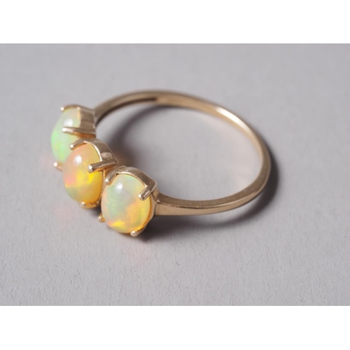 274 - A 9ct gold opal three-stone dress ring, size Q, 2.1g