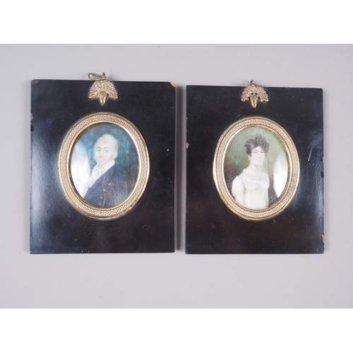 311 - Two early 19th century portrait miniatures of a woman and a man, in ebonised frames, two prints of s... 