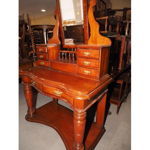 384 - A late 19th century mahogany serpentine fronted Duchesse dressing table with shape top bevelled mirr... 