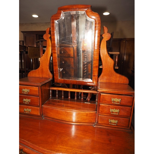 384 - A late 19th century mahogany serpentine fronted Duchesse dressing table with shape top bevelled mirr... 