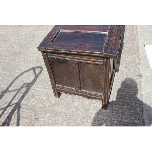 391 - An 18th century oak triple panel front coffer, on stile supports, 45