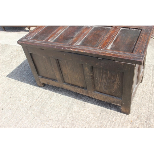 391 - An 18th century oak triple panel front coffer, on stile supports, 45