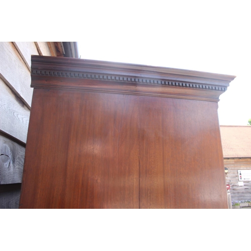 424 - A George III figured mahogany chest on chest with dentil cornice over three short and six long gradu... 