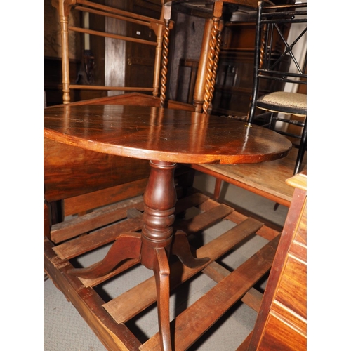 437 - A 19th century mahogany circular tilt top occasional table, on turned column and tripod splay suppor... 