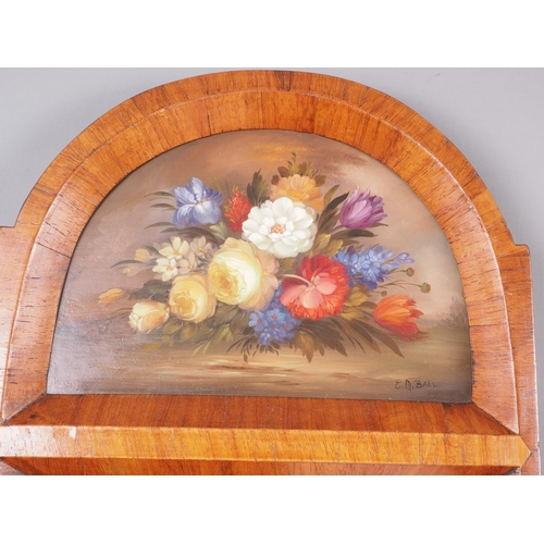 448 - A walnut framed wall mirror with still life over, plate 14