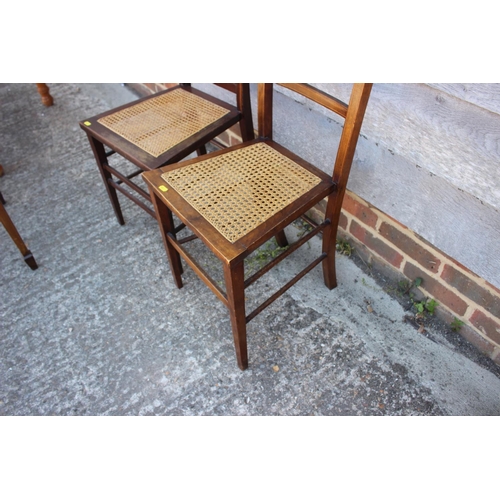 467 - Two Edwardian walnut and line inlaid cane seat bedroom chairs, on stretchered supports